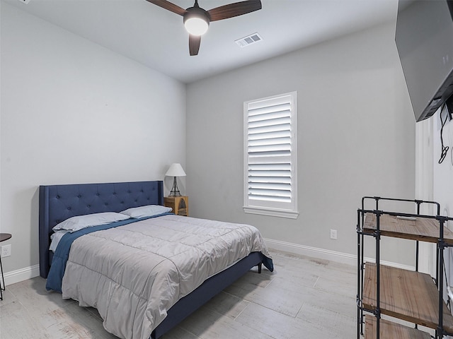 2815 Spring Creek Trl, Celina, TX 75078 - bedroom featuring light wood-style flooring, baseboards, and a ceiling fan