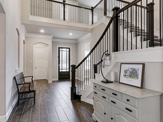 2815 Spring Creek Trl, Celina, TX 75078 - foyer featuring ornamental molding, baseboards, a towering ceiling, stairway, and dark wood finished floors