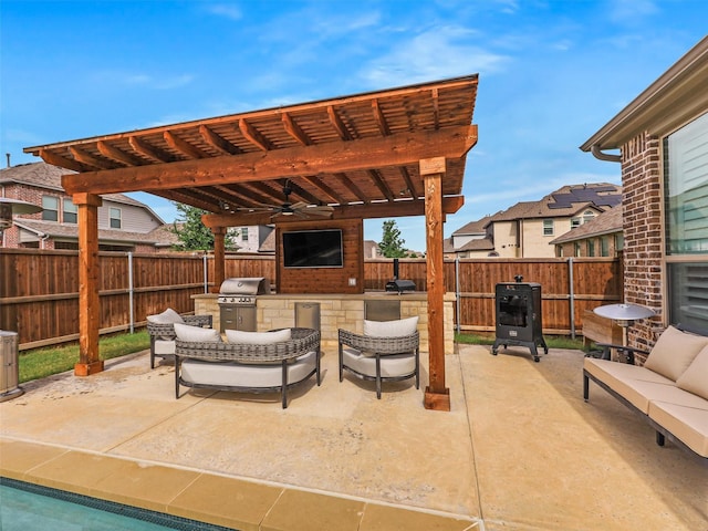 2815 Spring Creek Trl, Celina, TX 75078 - fenced backyard featuring outdoor lounge area, an outdoor kitchen, a patio area, ceiling fan, and a pergola