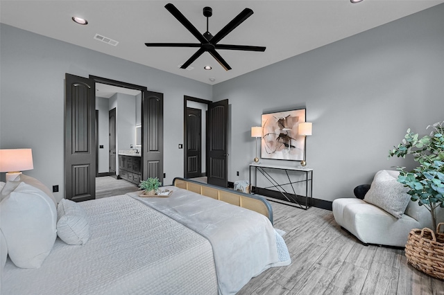 58 Lone Oak Blvd, Pottsboro, TX 75076 - bedroom featuring light wood finished floors, baseboards, recessed lighting, a ceiling fan, and ensuite bath
