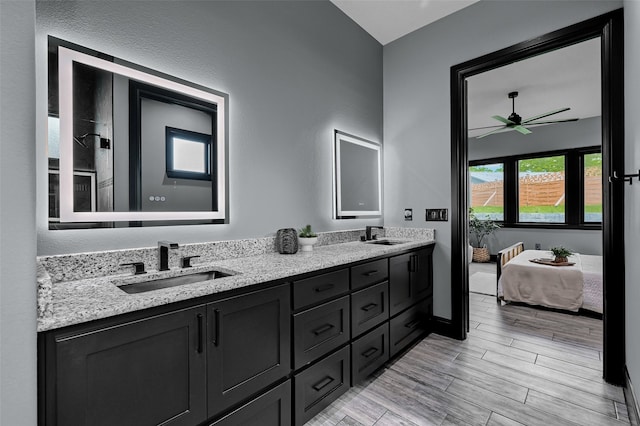 58 Lone Oak Blvd, Pottsboro, TX 75076 - bathroom with double vanity, ceiling fan, ensuite bathroom, wood finished floors, and baseboards
