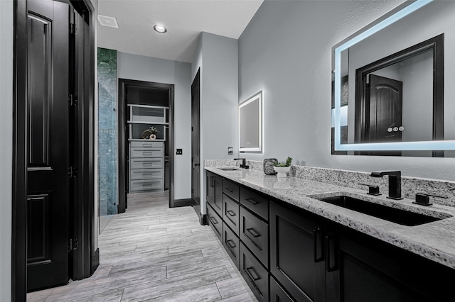 58 Lone Oak Blvd, Pottsboro, TX 75076 - bathroom with double vanity and wood finished floors