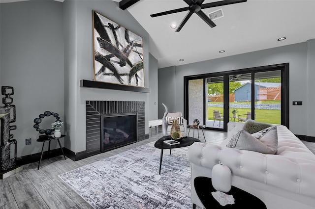 58 Lone Oak Blvd, Pottsboro, TX 75076 - living room featuring a glass covered fireplace, wood finished floors, ceiling fan, baseboards, and recessed lighting