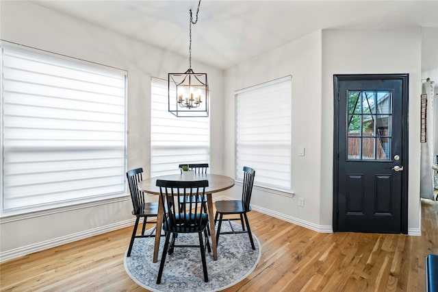 7812 Rockledge Dr, Mckinney, TX 75071 - dining room with light wood-style floors, a chandelier, and baseboards
