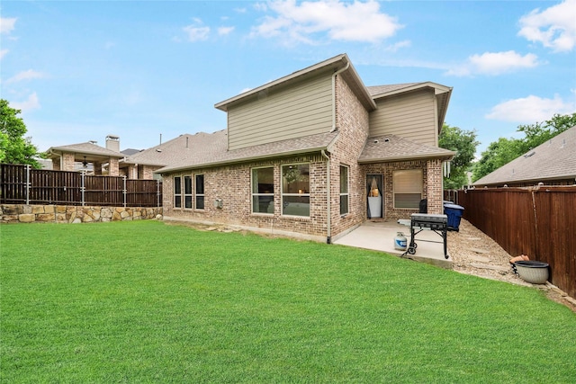 7812 Rockledge Dr, Mckinney, TX 75071 - rear view of property featuring a patio, brick siding, and a shingled roof