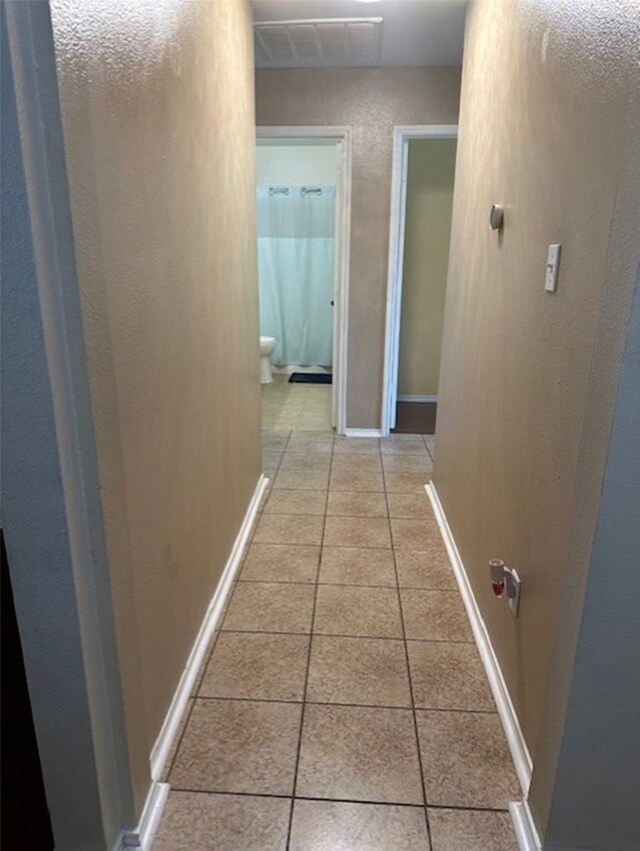 440 Maggie Cir, Flint, TX 75762 - hallway with light tile patterned floors and baseboards