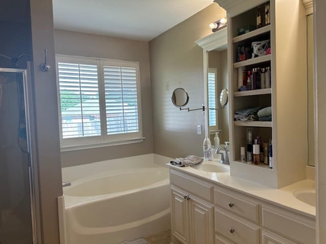 440 Maggie Cir, Flint, TX 75762 - full bathroom with a garden tub, double vanity, and a shower stall