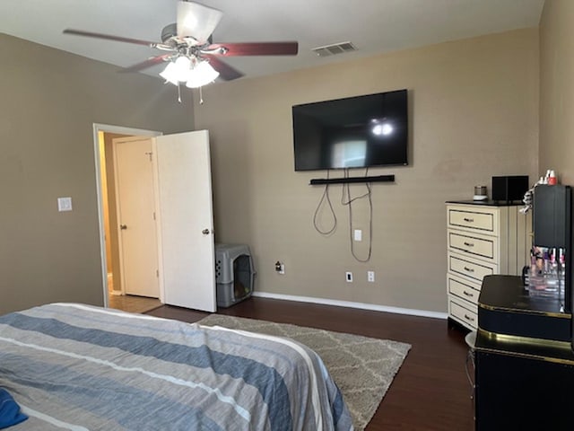 440 Maggie Cir, Flint, TX 75762 - bedroom with dark wood-type flooring, baseboards, and a ceiling fan