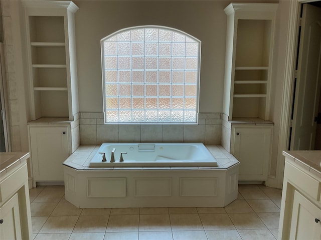 5704 El Campo Ave, Fort Worth, TX 76107 - full bath featuring a tub with jets, vanity, tile patterned floors, and built in shelves