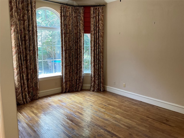 5704 El Campo Ave, Fort Worth, TX 76107 - unfurnished room with hardwood / wood-style flooring, healthy amount of natural light, and baseboards