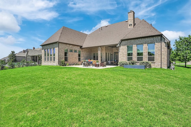 512 Maggie Trl, Allen, TX 75002 - back of property featuring a patio area, brick siding, and a yard