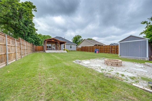 205 W Travis St, Howe, TX 75459 - view of yard with an outdoor fire pit and an outbuilding