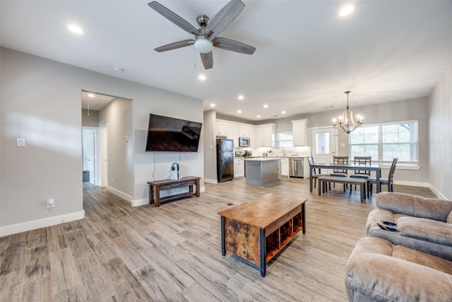 205 W Travis St, Howe, TX 75459 - living area with attic access, ceiling fan, baseboards, light wood-style floors, and recessed lighting