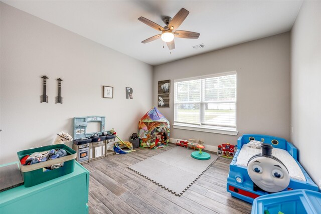 205 W Travis St, Howe, TX 75459 - playroom featuring ceiling fan and wood finished floors