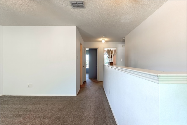 2036 Shawnee Trl, Fort Worth, TX 76247 - hall featuring a textured ceiling, carpet, and baseboards