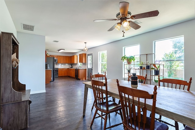 2036 Shawnee Trl, Fort Worth, TX 76247 - dining area featuring dark wood-type flooring, a ceiling fan, and baseboards