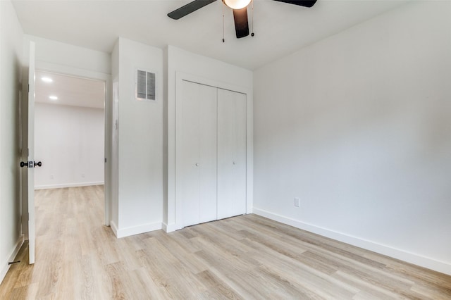 626 Thrush Ave, Duncanville, TX 75116 - unfurnished bedroom featuring light wood-style flooring, a closet, baseboards, and a ceiling fan