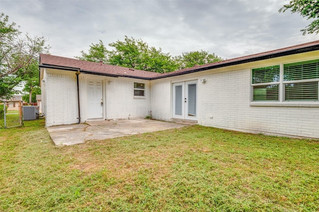 626 Thrush Ave, Duncanville, TX 75116 - back of house featuring french doors, brick siding, a patio area, central AC, and a gate