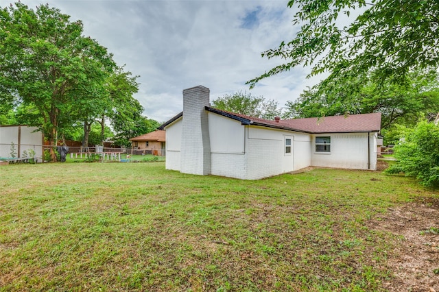 626 Thrush Ave, Duncanville, TX 75116 - rear view of house featuring a chimney and brick siding
