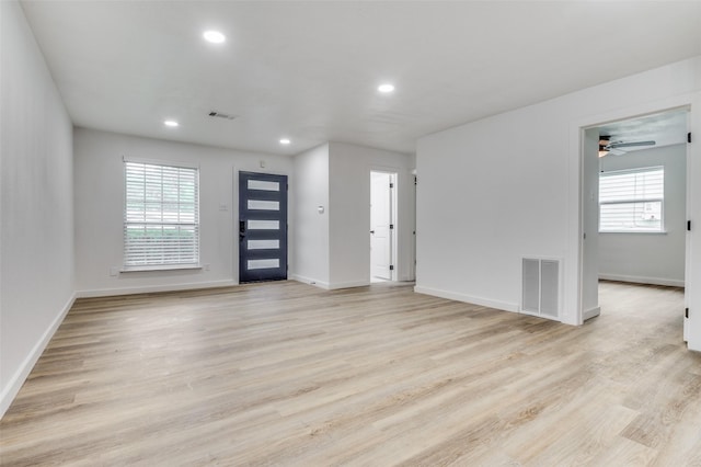 626 Thrush Ave, Duncanville, TX 75116 - unfurnished living room with baseboards, recessed lighting, light wood-style floors, and ceiling fan