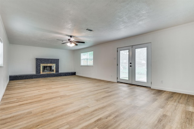 626 Thrush Ave, Duncanville, TX 75116 - unfurnished living room with a ceiling fan, light wood-style floors, crown molding, french doors, and baseboards