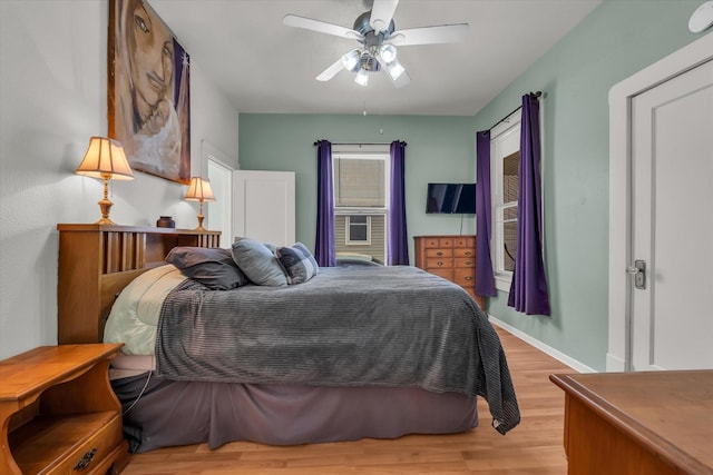 1710 Mckenzie Ave, Waco, TX 76708 - bedroom with wood finished floors, baseboards, and ceiling fan