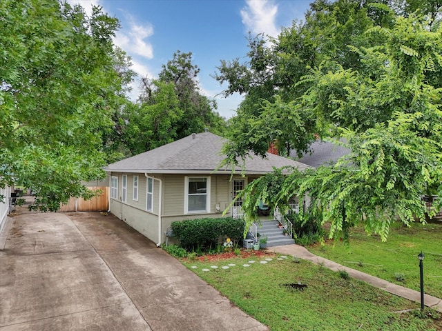 1710 Mckenzie Ave, Waco, TX 76708 - bungalow featuring covered porch, concrete driveway, roof with shingles, and a chimney