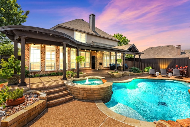 5820 Lakeland Ct, Sachse, TX 75048 - view of swimming pool with a patio, a fenced backyard, and a pool with connected hot tub