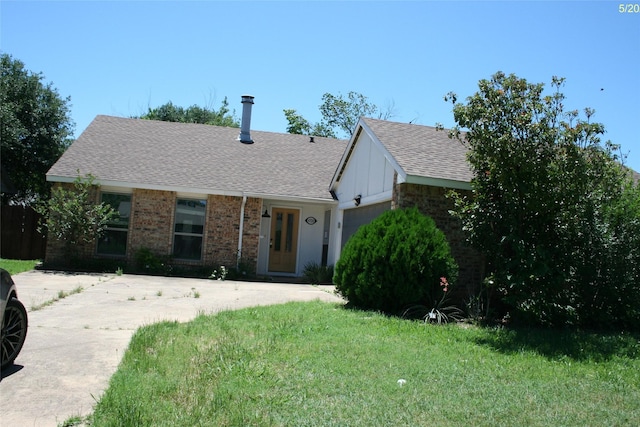 4720 Scots Briar Ln, Fort Worth, TX 76137 - view of front of house with a garage, a shingled roof, a front lawn, and brick siding