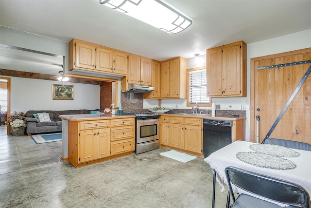kitchen with dishwasher, stainless steel gas range oven, a peninsula, under cabinet range hood, and a sink