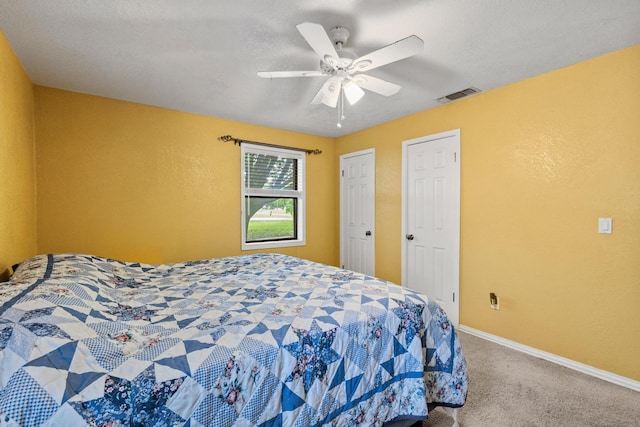 201 S Caney St, Dodd City, TX 75438 - carpeted bedroom with baseboards, a ceiling fan, and a textured wall
