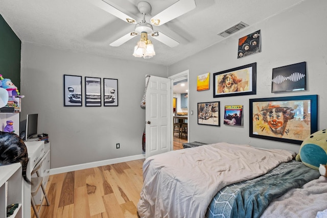 201 S Caney St, Dodd City, TX 75438 - bedroom with light wood-style floors, baseboards, and a ceiling fan