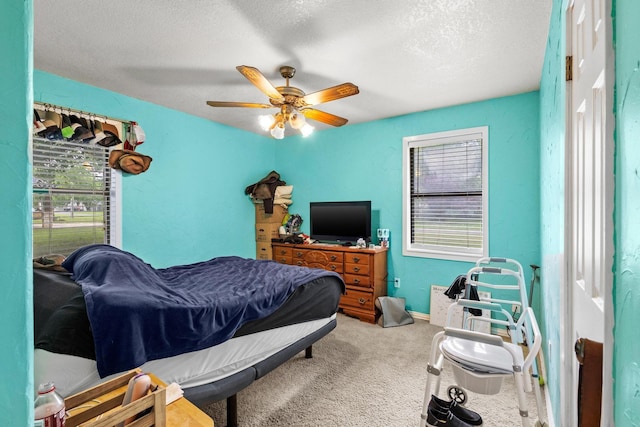 201 S Caney St, Dodd City, TX 75438 - carpeted bedroom featuring ceiling fan, a textured ceiling, and baseboards