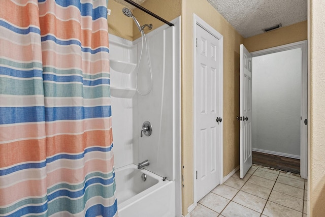 201 S Caney St, Dodd City, TX 75438 - full bath featuring tile patterned flooring, shower / bath combo with shower curtain, and a textured ceiling
