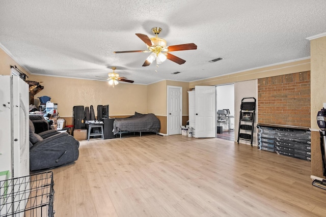 201 S Caney St, Dodd City, TX 75438 - living area with a ceiling fan, wood finished floors, a textured ceiling, and crown molding