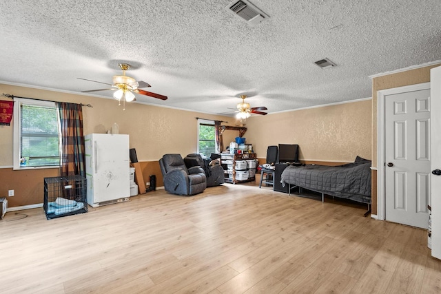 201 S Caney St, Dodd City, TX 75438 - bedroom featuring a textured ceiling, multiple windows, crown molding, a textured wall, and wood finished floors
