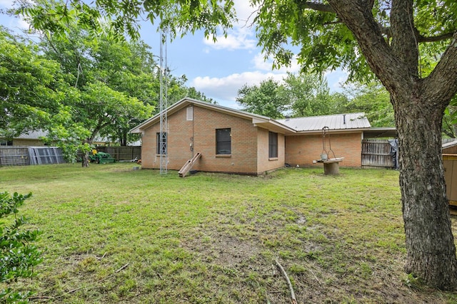 201 S Caney St, Dodd City, TX 75438 - rear view of property with brick siding and metal roof