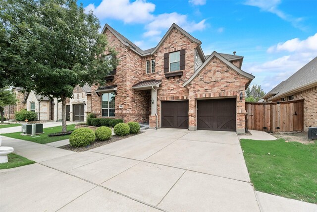 6809 Gallatin St, Mckinney, TX 75070 - view of front facade featuring brick siding, driveway, and an attached garage