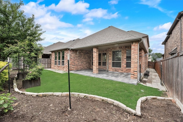 6809 Gallatin St, Mckinney, TX 75070 - rear view of property with brick siding, roof with shingles, and a patio area