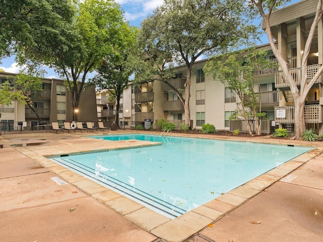 4859 Cedar Springs Rd Unit 150, Dallas, TX 75219 - community pool with a patio area and a residential view