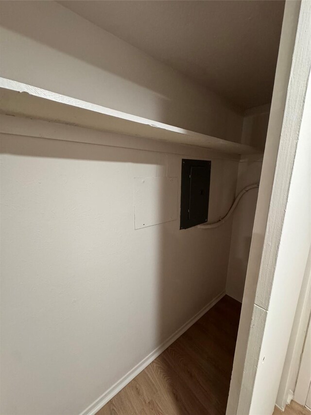4859 Cedar Springs Rd Unit 150, Dallas, TX 75219 - walk in closet featuring electric panel and wood finished floors