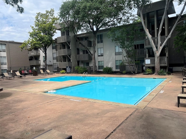 4859 Cedar Springs Rd Unit 150, Dallas, TX 75219 - community pool featuring a patio area