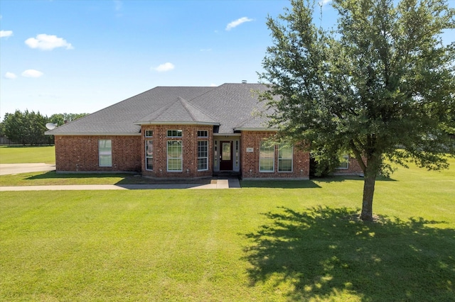 208 Burtonwood Cir, Ovilla, TX 75154 - view of front facade featuring a front yard, brick siding, and a shingled roof