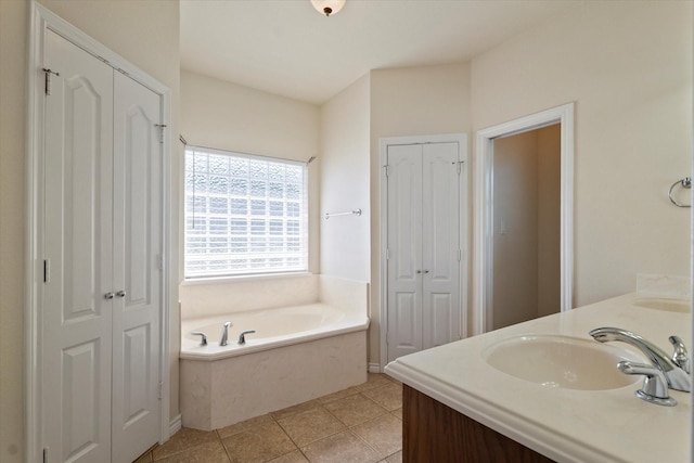 208 Burtonwood Cir, Ovilla, TX 75154 - bathroom featuring a closet, double vanity, a bath, and tile patterned floors
