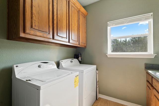 208 Burtonwood Cir, Ovilla, TX 75154 - washroom featuring separate washer and dryer, cabinet space, and baseboards