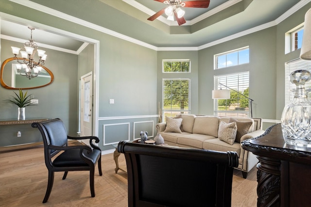 208 Burtonwood Cir, Ovilla, TX 75154 - living area with ceiling fan, a chandelier, light wood-style floors, crown molding, and a raised ceiling
