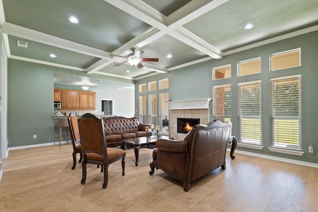 208 Burtonwood Cir, Ovilla, TX 75154 - living area with beamed ceiling, recessed lighting, a ceiling fan, light wood-type flooring, and a tile fireplace