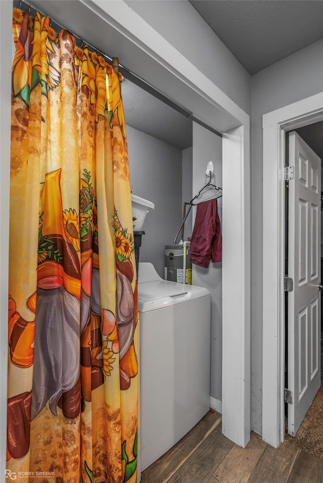 371 Lakeview Dr, Doyline, LA 71023 - laundry area featuring wood finished floors, washer / dryer, and water heater