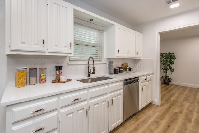 3420 Hampshire Dr, Arlington, TX 76013 - kitchen featuring dishwasher, a sink, white cabinets, tasteful backsplash, and light countertops