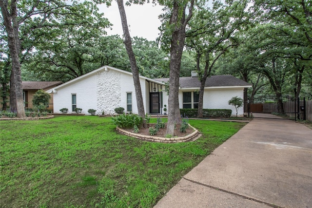 3420 Hampshire Dr, Arlington, TX 76013 - mid-century inspired home featuring driveway, brick siding, and a gate